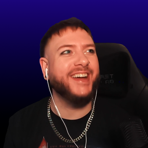 Picture of Austin in his chair, with a blue background, looking to the right.