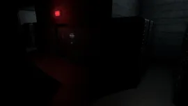Dimly lit corridor with dark walls, a closed door marked by a small sign, and a red light casting a faint glow.