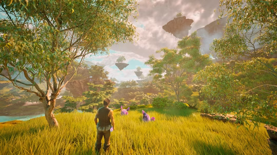 A player character standing in a lush green meadow with tall grass and sun-drenched trees. In the distance, several rocky islands float in a hazy blue sky above a deep valley.