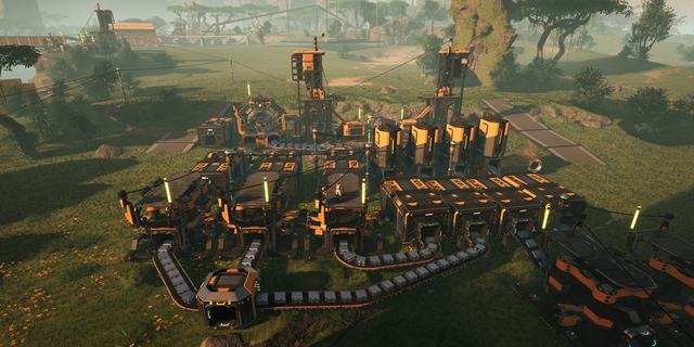 A complex industrial facility with conveyor belts, machinery, and interconnected structures in a lush, green landscape.