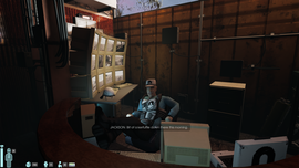 A person in a security room monitors multiple screens, wearing a cap and uniform. Text on screen reads, "JACKSON: Bit of a kerfuffle down there this morning."