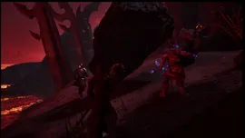Dark volcanic cavern lit by lava; armored adventurers confront a hulking fur-clad foe channeling blue magic amid jagged rock formations.