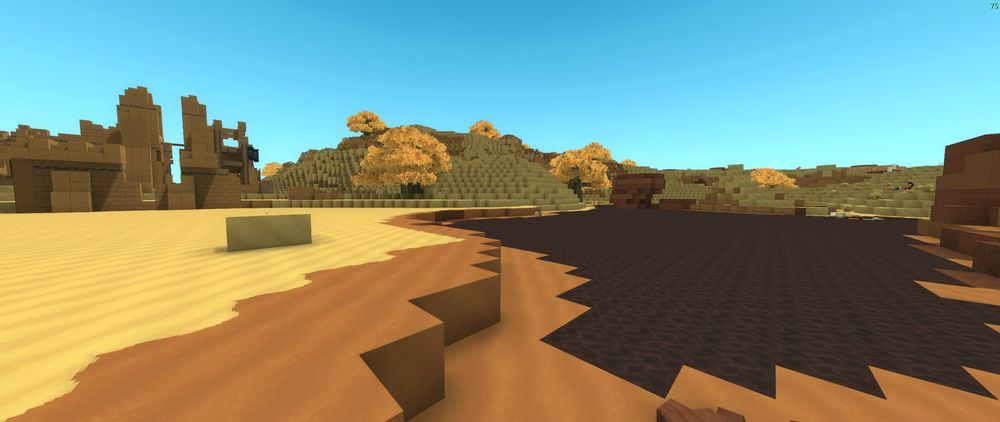Badlands biome in Hytale showing dry rocky terrain, sandy ground, and weathered landscape formations.