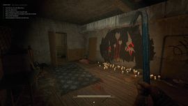 A dark, atmospheric indoor room in s&box featuring a crowbar in the foreground, candlelight, and eerie red-and-black artwork on a concrete wall.