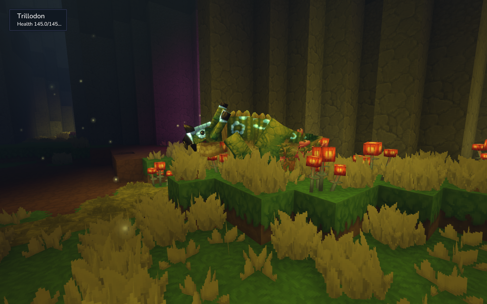 A green Trillodon dinosaur standing in a lush, bioluminescent cavern in Hytale. The creature is surrounded by tall yellow grass and glowing orange flowers, with the dark stone walls of the Underground Jungle visible in the background.