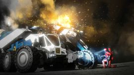 A large, multi-wheeled industrial rover in Space Engineers experiencing a bright orange explosion on its chassis while driving across a rocky planetary surface.