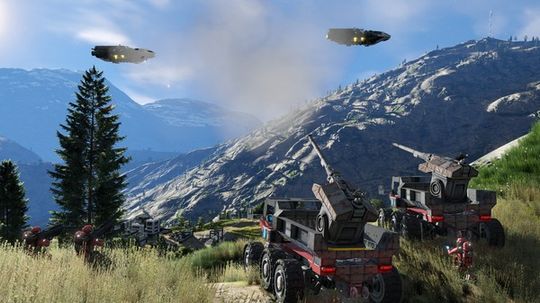 A fleet of custom-built multi-wheeled rovers and industrial vehicles driving across a grassy valley toward snow-capped mountains in Space Engineers.